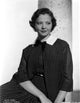 Sylvia Sidney posed in checkered blazer and skirt photo print