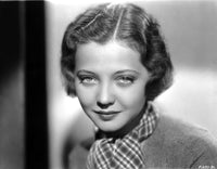 Sylvia Sidney photo print in printed scarf and textured blouse.