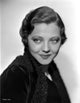 Sylvia Sidney wearing a black coat photo print