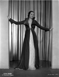 Sylvia Sidney wearing a black long sleeve and long coat photo print.