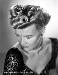 Close up portrait photo print of Penny Singleton in black floral dress.