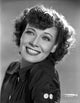 Penny Singleton smiling in black blouse close-up portrait photo print.