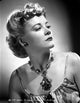 Penny Singleton portrait photo print wearing flower necklace.