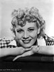 Penny Singleton smiling close-up portrait photo print on white background.
