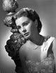 Jean Simmons portrait in white embroidered silk dress with pearl necklace photo print.