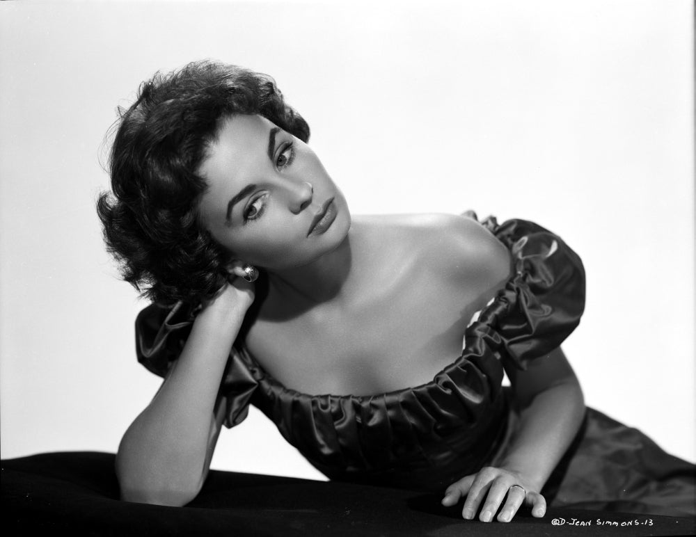 Jean Simmons posed in a black off shoulder bubble dress photo print.