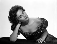 Jean Simmons posed in a black off shoulder bubble dress photo print.