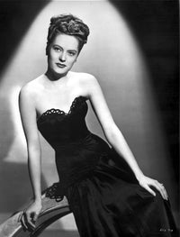 Alexis Smith seated in a black dress photo print