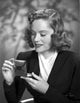 Alexis Smith Looking in a Small Mirror Photo Print