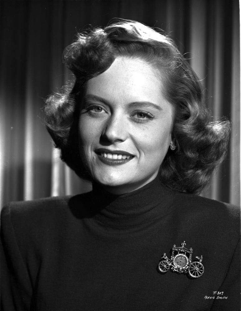 Alexis Smith smiling portrait photo print wearing a black shirt.