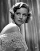 Margaret Sullivan Looking Away photo print in white dress with dark lipstick.