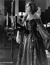 Blanch Sweet portrait photo print wearing an elegant gown, standing and looking up.