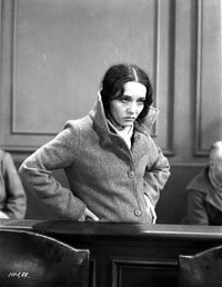 Lupe Velez standing in a sweater with hands on hips photo print.