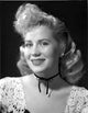 Jacqueline White Portrait in Black Dress with White Lace Sleeve Photo Print