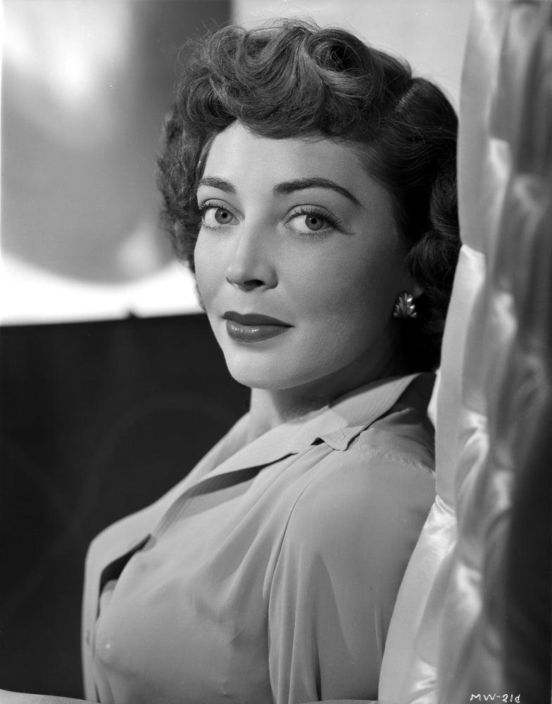 Marie Wilson posed in elegant white dress with curly hairstyle photo print.