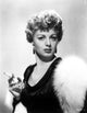 Classic photo print of Shelley Winters holding a cigarette.
