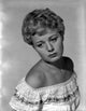 Classic portrait photo print of Shelley Winters wearing a white off-shoulder top.