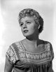 Close up portrait photo print of Shelley Winters in a blouse.