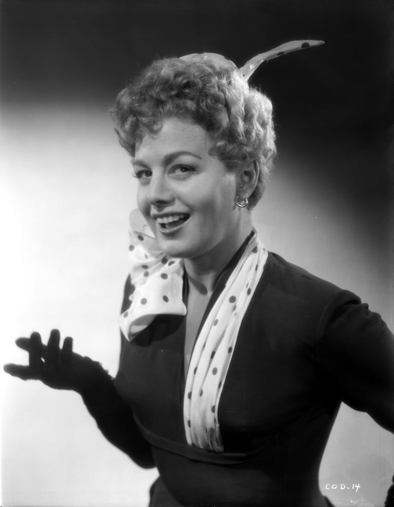 Shelley Winters portrait photo print in black shirt and white polka dot scarf.