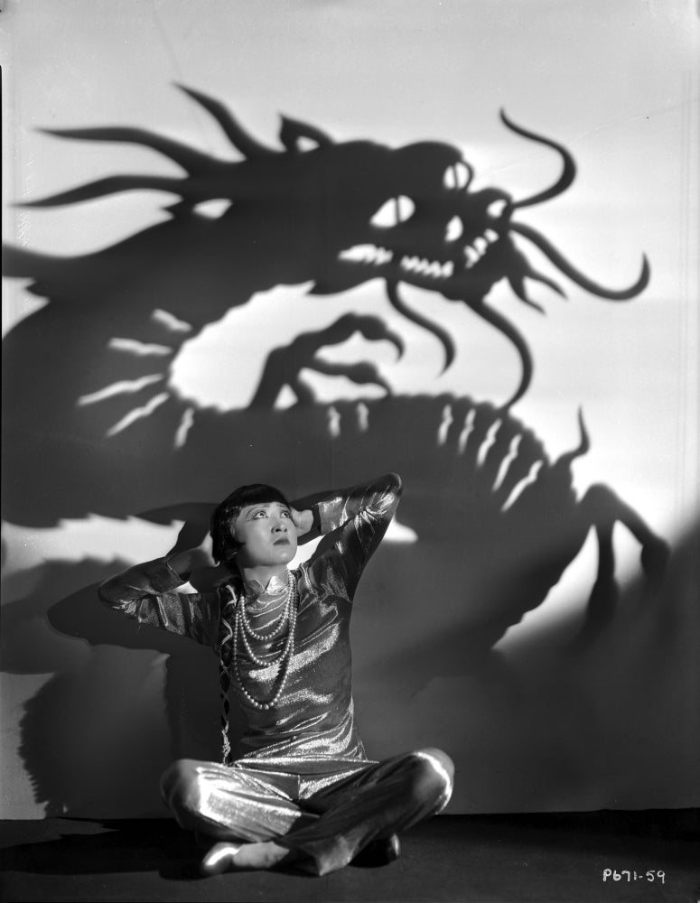 Anna Wong sitting on the floor with dragon background photo print