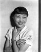Anna Wong wearing a white polo shirt photo print