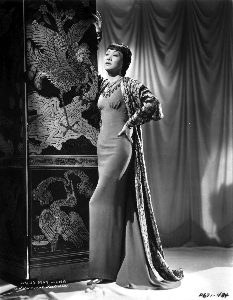 Anna Wong wearing a long sheath dress with robe photo print