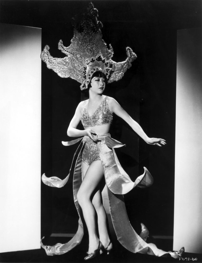 Photo print of Anna Wong wearing a huge headdress.