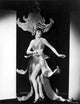 Photo print of Anna Wong wearing a huge headdress.