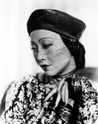 Anna Wong wearing a floral dress and beret photo print.