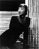 Anna Wong Leaning on a Table Photo Print showcasing elegance and charm.