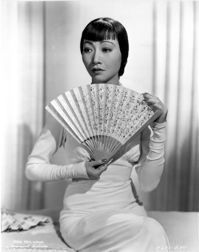 Anna Wong holding a fan photo print in elegant style