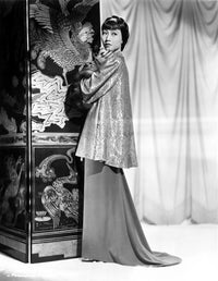 Anna Wong wearing a long glittering tunic, elegant photo print.