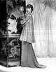 Anna Wong wearing a long glittering tunic, elegant photo print.