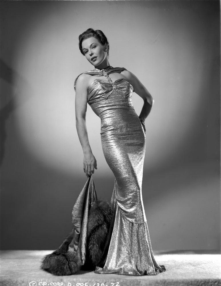 Joan Woodbury bending backwards in a long glossy gown photo print