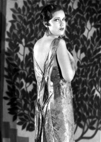 Fay Wray posed in a dress surrounded by plants - Photo Print