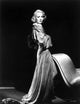 Jane Wyman in a grey long sleeve silk shoulder dress photo print.