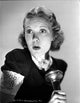 Jane Wyman Portrait in Black Velvet Shirt Holding a Flashlight