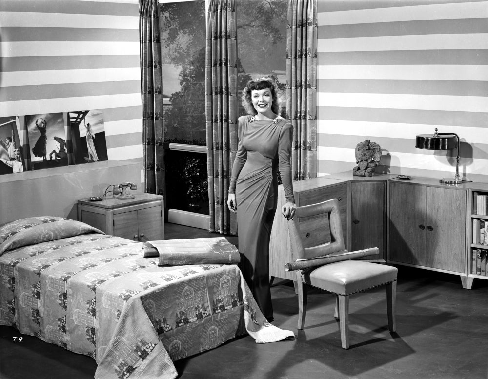 Jane Wyman posed in grey velvet pointed long sleeve dress photo print