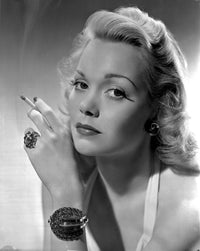 Classic photo print of Jane Wyman holding a cigarette.