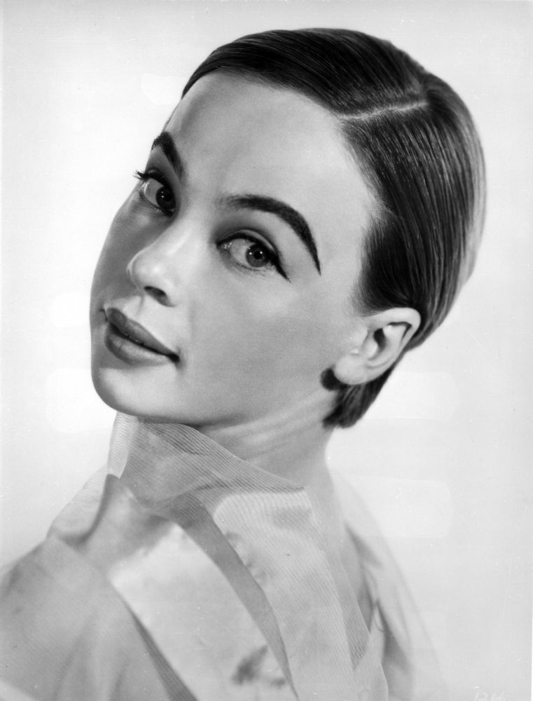 Leslie Caron posed on Side Ways with a white background photo print