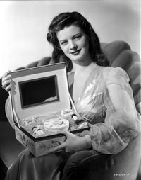 Gail Davis seated in classic photo print, elegant vintage photography.