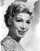 Dolores Gray smiling in black and white photo print