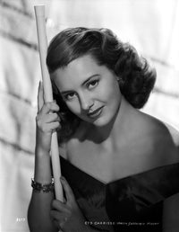 Cyd Charisse posed in a black dress with a bracelet photo print