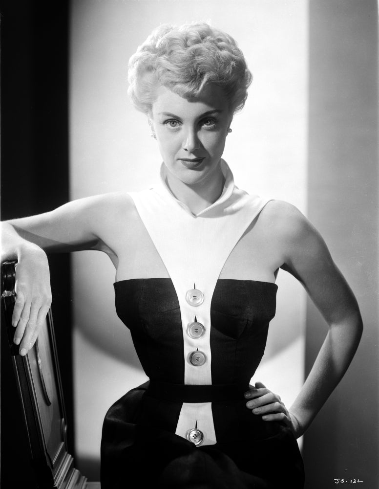 Jan Sterling portrait in black velvet dress with white collar neck strap