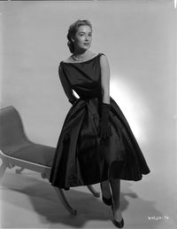Vera Miles in a black gown on a chaise lounger photo print