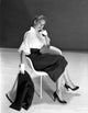 Vera Miles elegant photo print in white and black attire, seated pose.