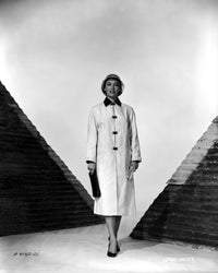 Vera Miles vintage photo print standing between two pyramids in a stylish jacket.