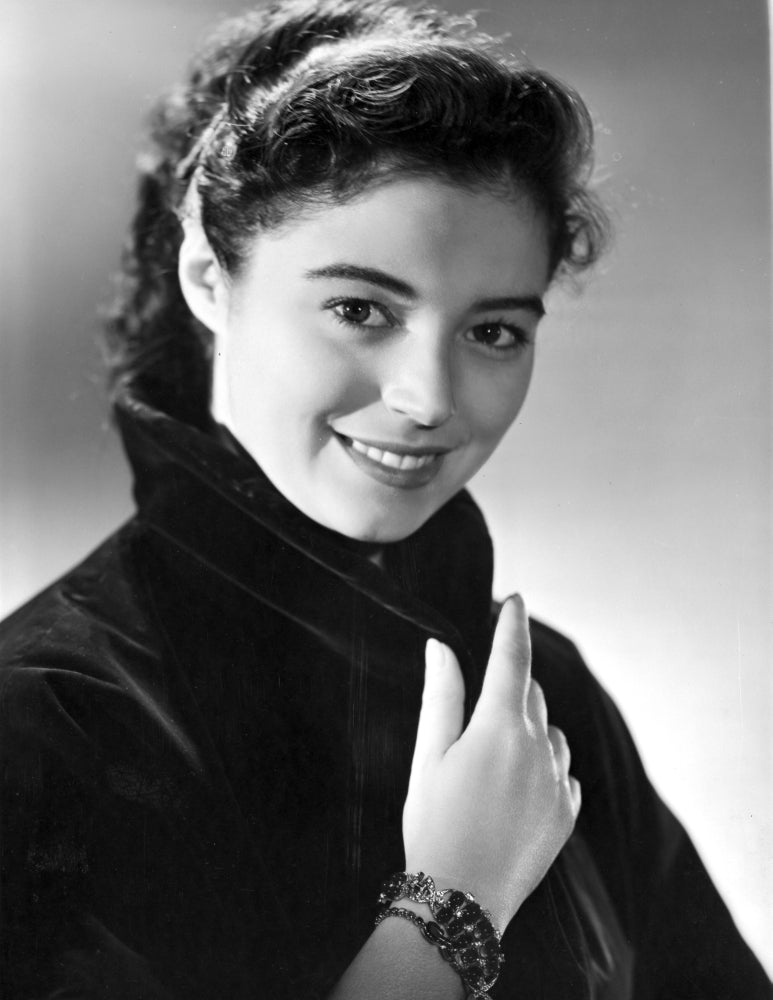 Marisa Pavan posed in a black suit with a smile photo print.