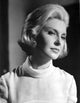 Joanne Woodward wearing a white tunic photo print.