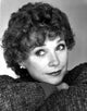 Shirley MacLaine smiling in a cozy sweater photo print